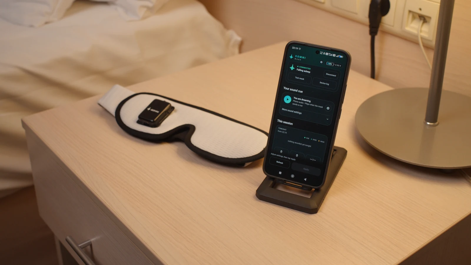 Somni Mask and a connected phone showing the Bluetooth app